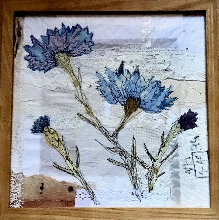 Framed flowers made from textiles